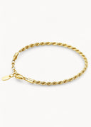 Connection gull armbånd på en lys beige bakgrunn
